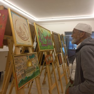 Mr Edwards talks on his illustrations, telling a different story of each art piece.